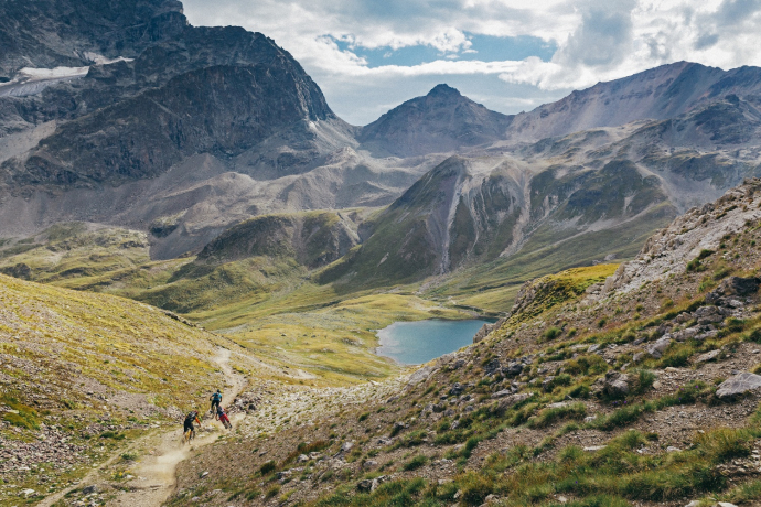 Biker on the way down from Piz Nair to Suvrettapass