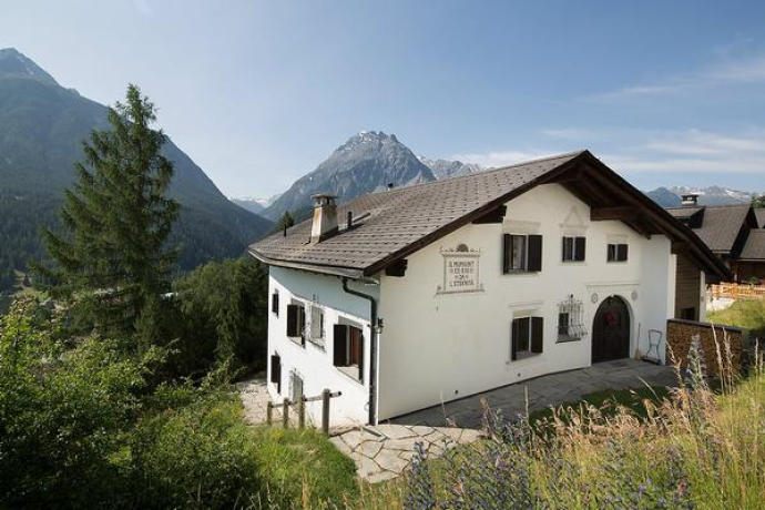 The Chasa Diala, an Engadine house on a slope with stunning views to the south of the mountains.