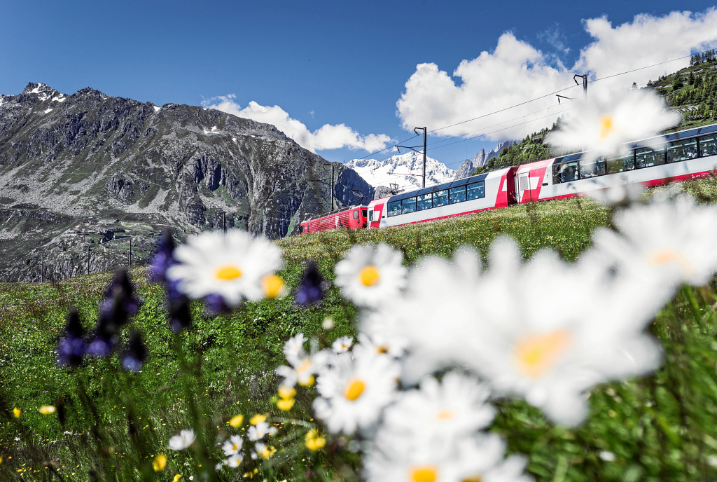 The Glacier Express of the Rhaetian Railway at the Oberalp Pass