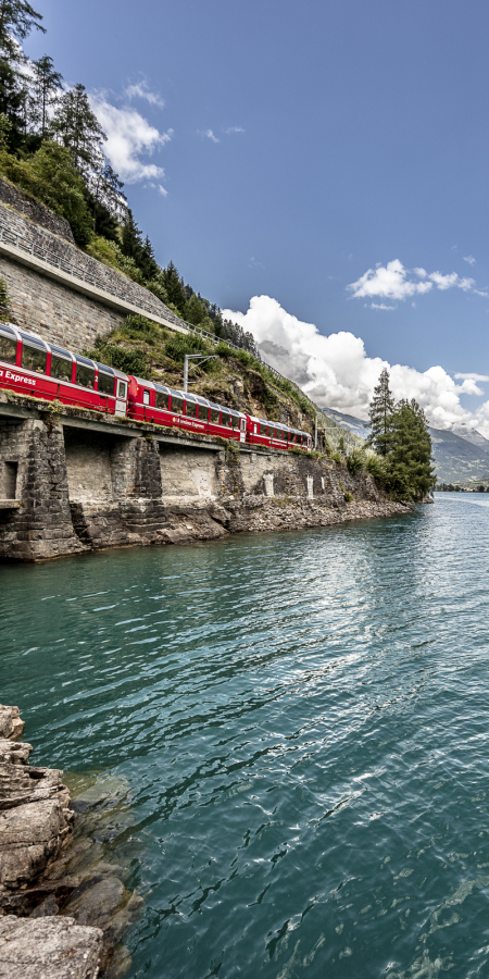 The Bernina Express of the Rhaetian Railway at Lago di Poschiavo