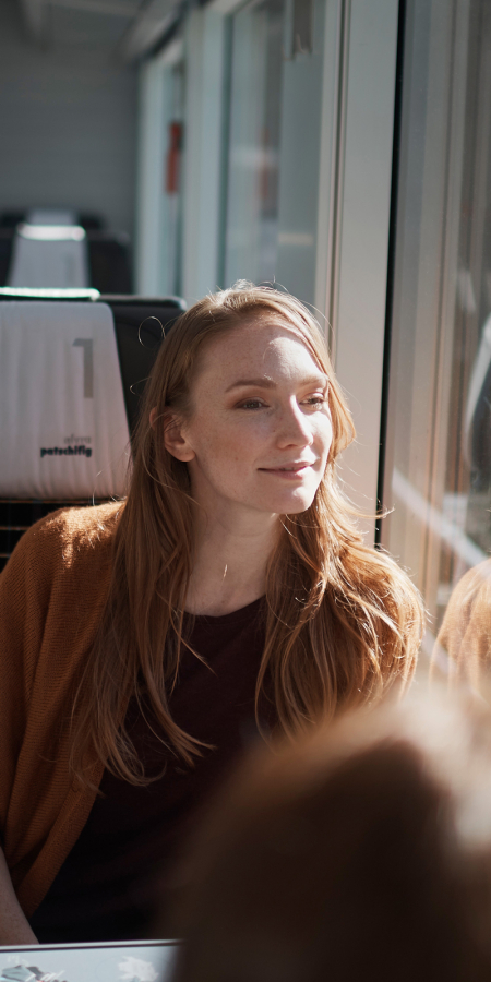 Woman on a Rhaetian Railway train looking out of the window