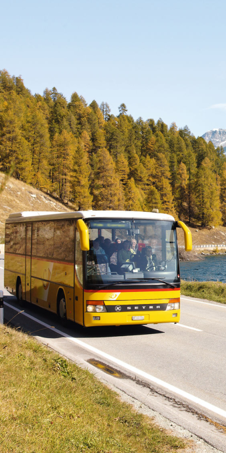 PostBus on the road in Engadine St. Moritz