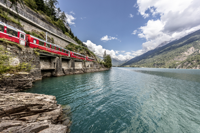 The Bernina Express of the Rhaetian Railway at Lago di Poschiavo